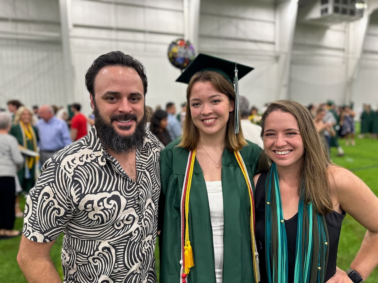 Proud aunt and uncle with the new grad, Ellie