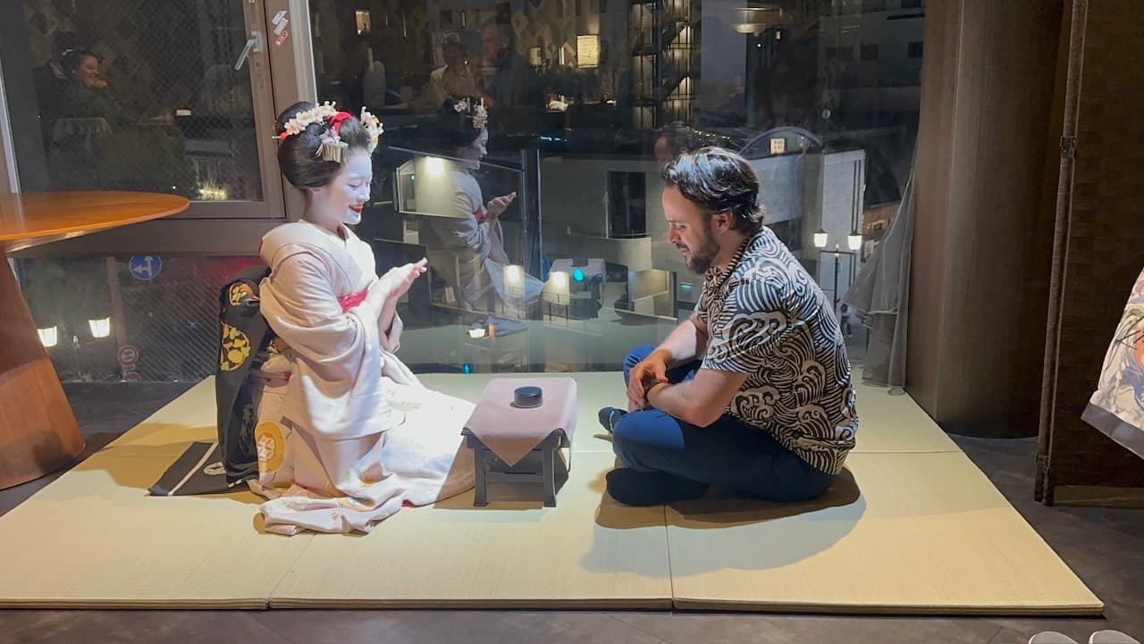 Shawn playing a drinking game with a maiko in Kyoto, Japan
