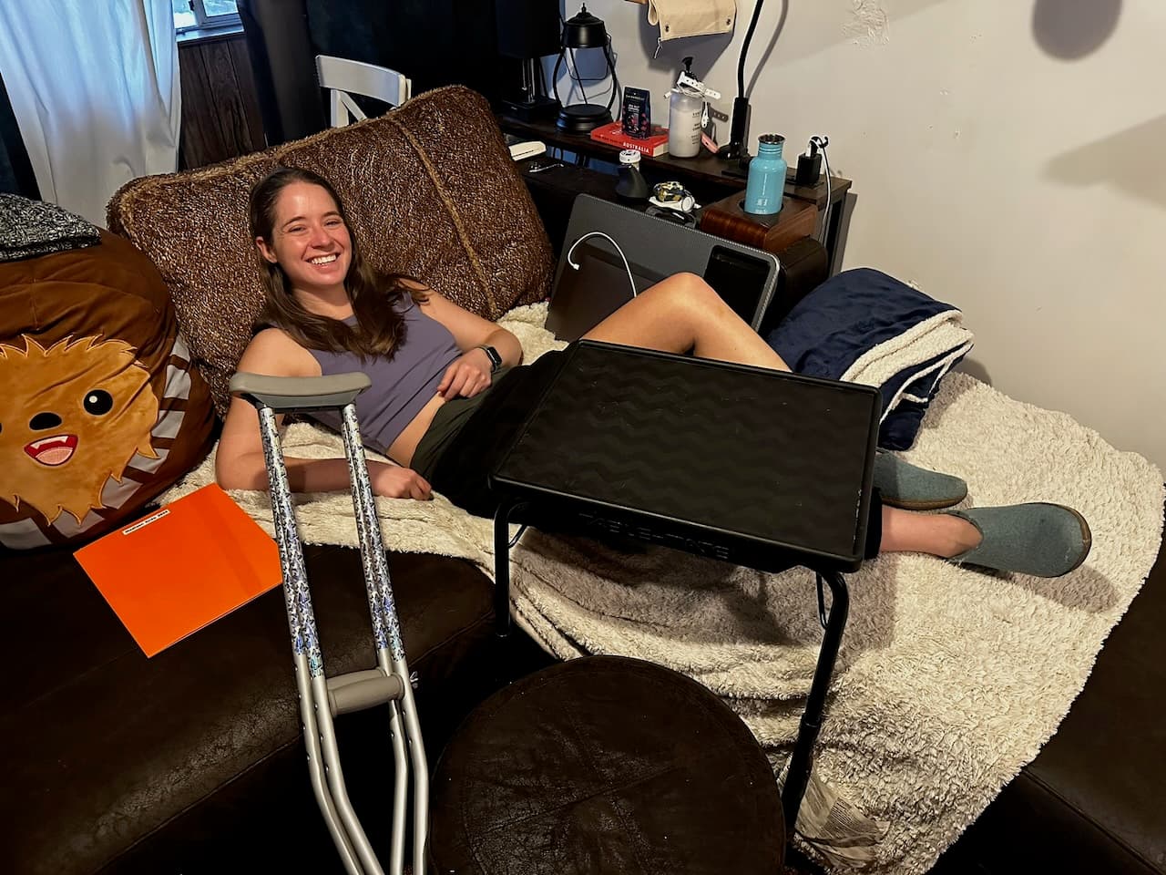 Madison with a pop-up table that Shawn setup to protect her knee from the cats