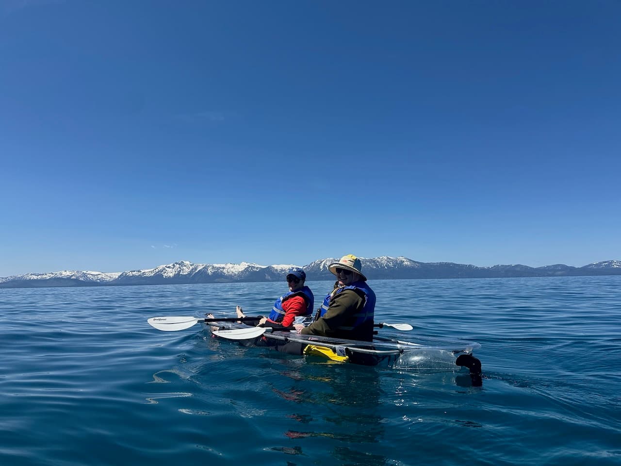 Abby and Lisa on a tour on Lake Tahoe in a clear kayak during their visit to Tahoe