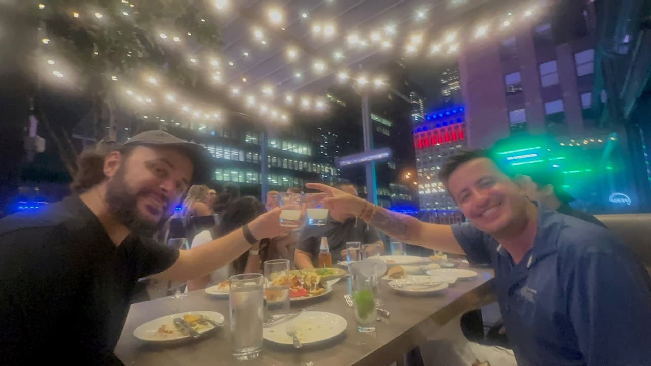 Shawn and Madison's co-worker, Edison, on a very humid night at a rooftop bar in New York City