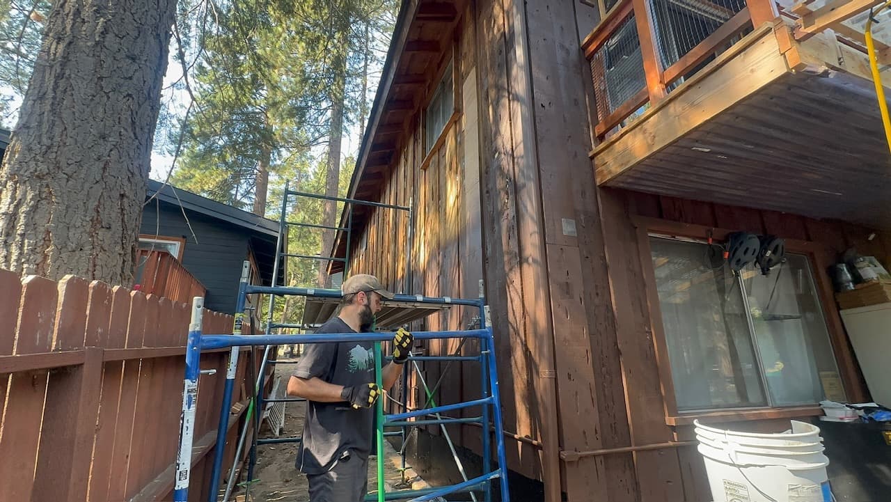 Shawn worked on re-painting the siding on the house as one of his many summer projects