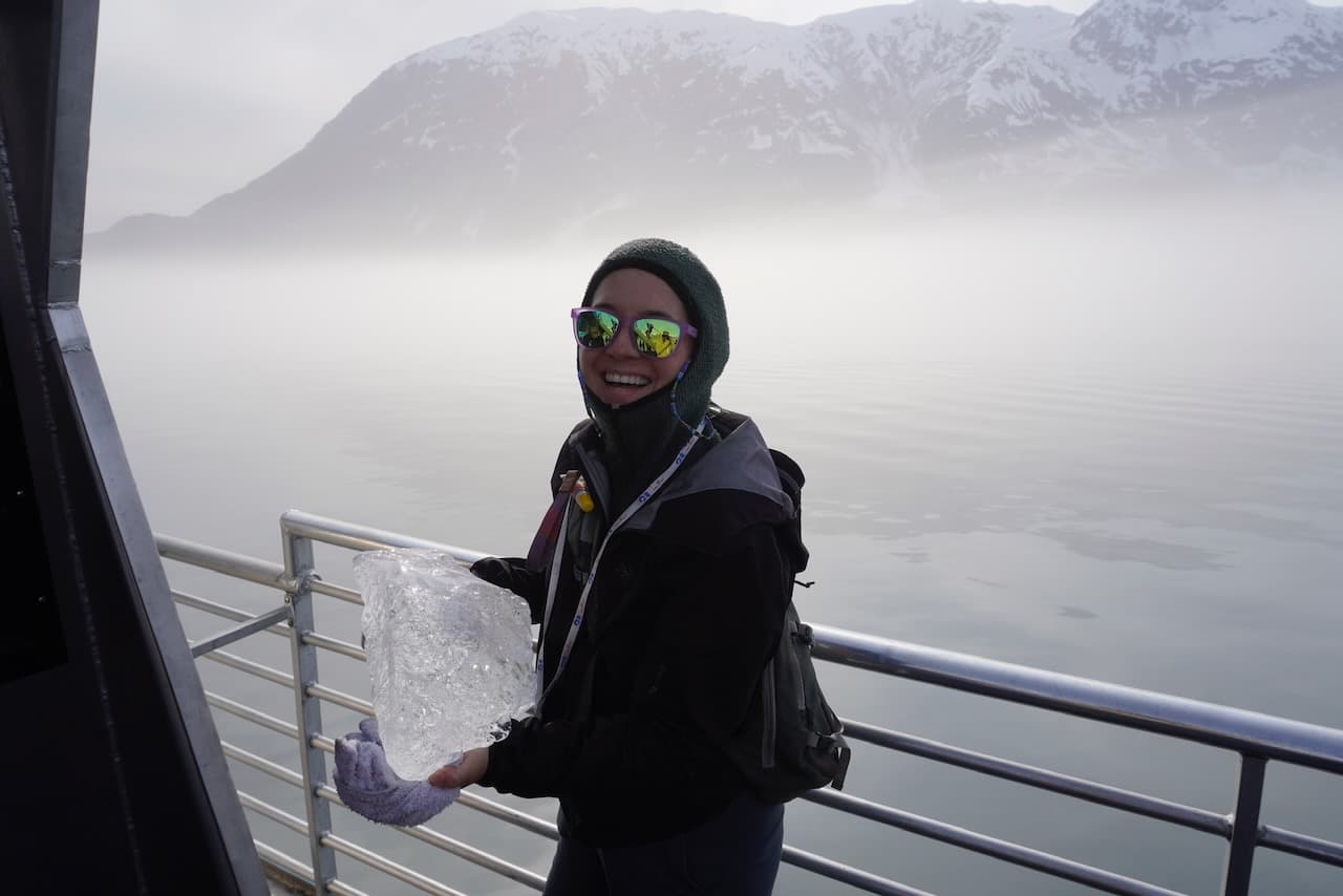 Madison holding the remnants of an iceberg en route to the Hubbard Glacier